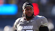 Nov 16, 2024; Boulder, Colorado, USA; Colorado Buffaloes offensive tackle Jordan Seaton (77) looks on before the game against the Utah Utes at Folsom Field. Mandatory Credit: Ron Chenoy-Imagn Images