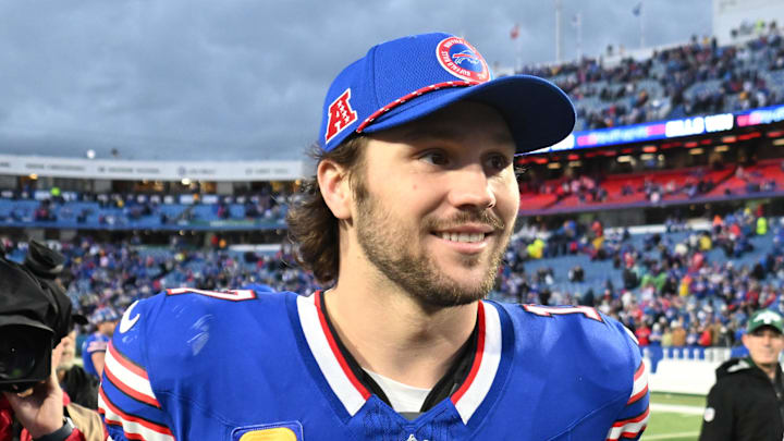Buffalo Bills quarterback Josh Allen walks off the field after a win. Buffalo Bills quarterback Josh Allen walks off the field after a win.