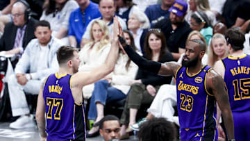 Apr 9, 2025; Dallas, Texas, USA;  Los Angeles Lakers guard Luka Doncic (77) celebrates with Los Angeles Lakers forward LeBron James (23) during the fourth quarter against the Dallas Mavericks at American Airlines Center. Mandatory Credit: Kevin Jairaj-Imagn Images