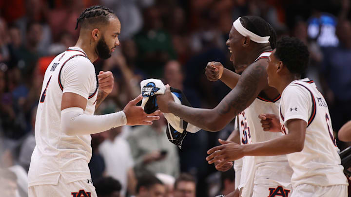Mar 30, 2025; Atlanta, GA, USA; Auburn Tigers forward Johni Broome (4) celebrates with teammates after a play during the first half in the South Regional final of the 2025 NCAA tournament against the Michigan State Spartans at State Farm Arena. Mandatory Credit: Brett Davis-Imagn Images