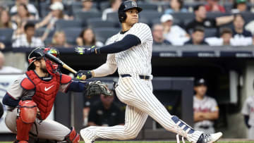 Jun 22, 2024; Bronx, New York, USA; New York Yankees right fielder Juan Soto (22) hits a single against the Atlanta Braves in the third inning at Yankee Stadium. Mandatory Credit: Wendell Cruz-USA TODAY Sports