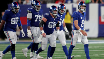 Oct 2, 2023; East Rutherford, New Jersey, USA; New York Giants quarterback Daniel Jones (8) walks off the field with guards Marcus McKethan (60) and Joshua Ezeudu (75) and Ben Bredeson (68) and Mark Glowinski (64) after being sacked during the fourth quarter against the Seattle Seahawks at MetLife Stadium.  