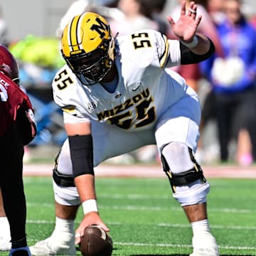 Oct 12, 2024; Amherst, Massachusetts, USA; Missouri Tigers offensive lineman Connor Tollison (55) snaps the ball during the first half against the Massachusetts Minutemen at Warren McGuirk Alumni Stadium. Mandatory Credit: Eric Canha-Imagn Images