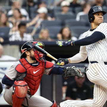 Jun 22, 2024; Bronx, New York, USA; New York Yankees right fielder Juan Soto (22) hits a single against the Atlanta Braves in the third inning at Yankee Stadium. 