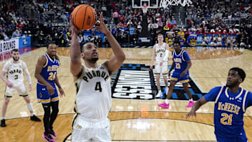 Mar 22, 2025; Providence, RI, USA; Purdue Boilermakers forward Trey Kaufman-Renn (4) shoots a layup against McNeese State Cowboys guard Sincere Parker (21) during the second half at Amica Mutual Pavilion.