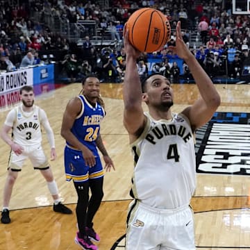 Mar 22, 2025; Providence, RI, USA; Purdue Boilermakers forward Trey Kaufman-Renn (4) shoots a layup against McNeese State Cowboys guard Sincere Parker (21) during the second half at Amica Mutual Pavilion.