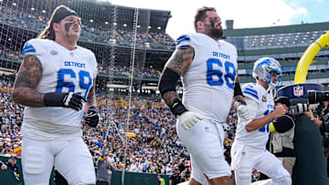 Detroit Lions guard Tate Ratledge (69), tackle Taylor Decker (68) and quarterback Jared Goff (16) take the field for the first half against the Green Bay Packers at Lambeau Field in Green Bay, Wis., on Sunday, September 7, 2025.