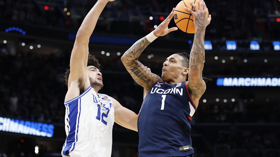 UConn guard Solo Ball scores against Duke forward Cameron Boozer during the Elite Eight.