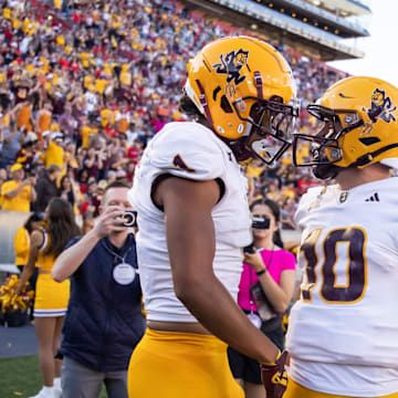 Nov 30, 2024; Tucson, Arizona, USA; Arizona State Sun Devils wide receiver Xavier Guillory (1) celebrates a touchdown with quarterback Sam Leavitt (10) against the Arizona Wildcats in the second half during the Territorial Cup at Arizona Stadium. Mandatory Credit: Mark J. Rebilas-Imagn Images
