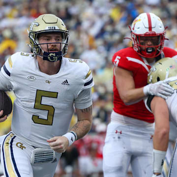 Sep 14, 2024; Atlanta, Georgia, USA; Georgia Tech Yellow Jackets quarterback Zach Pyron (5) runs the ball for a touchdown against the Virginia Military Institute Keydets in the second quarter at Bobby Dodd Stadium at Hyundai Field. Mandatory Credit: Brett Davis-Imagn Images