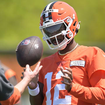May 10, 2025; Berea, OH, USA; Cleveland Browns quarterback Shedeur Sanders (12) talks to a coach during rookie minicamp at CrossCountry Mortgage Campus. Mandatory Credit: Ken Blaze-Imagn Images