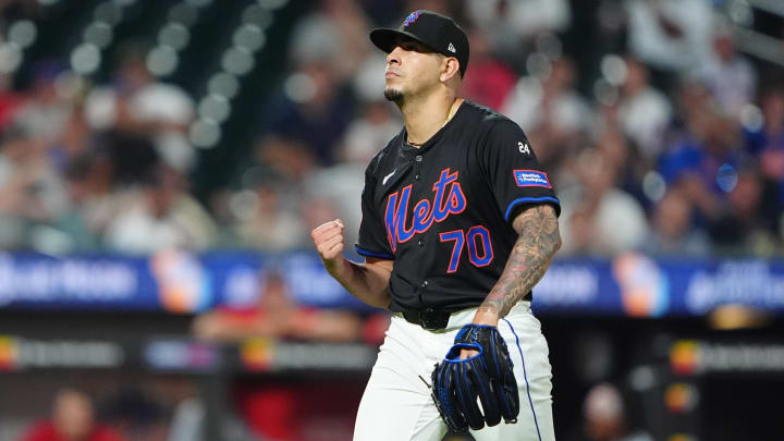 Jul 10, 2024; New York City, New York, USA; New York Mets pitcher Jose Butto (70) reacts to getting the third out during the eighth inning against the Washington Nationals at Citi Field. Mandatory Credit: Gregory Fisher-USA TODAY Sports