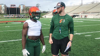 FAMU running back Davonne Kendrick gets instructions from assistant coach Joseph Henry during spring practice on Sunday, March 3, 2019.

Davonne Kendrick