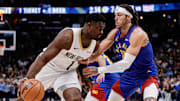 Jan 12, 2024; Denver, Colorado, USA; New Orleans Pelicans forward Zion Williamson (1) controls the ball as Denver Nuggets forward Aaron Gordon (50) guards in the first quarter at Ball Arena. Mandatory Credit: Isaiah J. Downing-Imagn Images