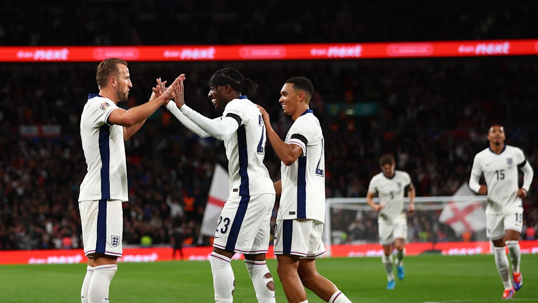 Noni Madueke and Trent Alexander-Arnold, England's two assisters on the night - congratulate Harry Kane