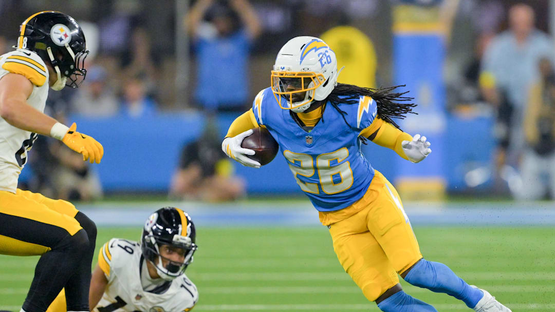 Nov 9, 2025; Inglewood, California, USA; Los Angeles Chargers cornerback Donte Jackson (26) carries the ball after an interception against the Pittsburgh Steelers during the fourth quarter of the game at SoFi Stadium. Mandatory Credit: Jayne Kamin-Oncea-Imagn Images