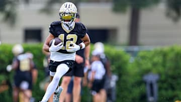 Chris Olave runs a drill during New Orleans Saints Mandatory Minicamp