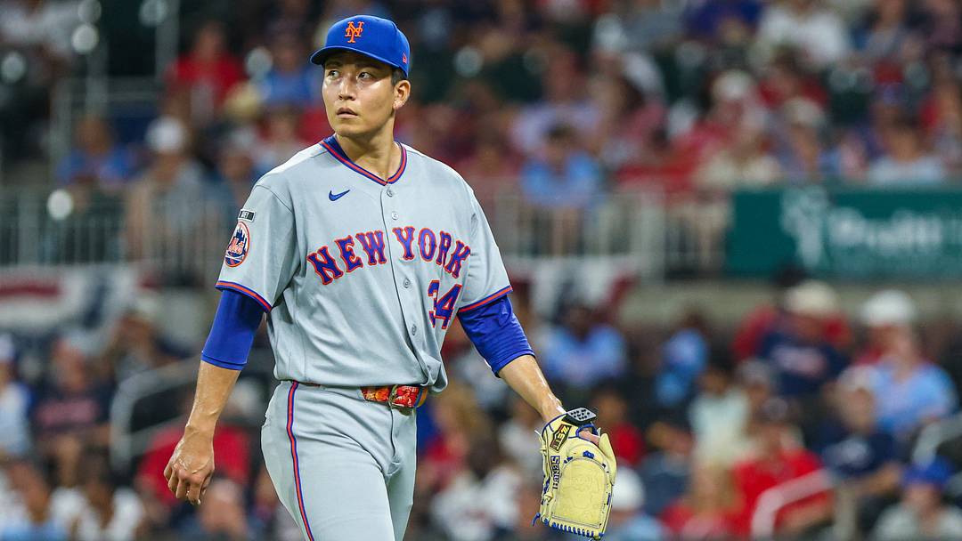 New York Mets pitcher Kodai Senga (34) walks to the dugout after pitching against the Atlanta Braves during the seventh inning at Truist Park.