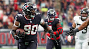 Nov 9, 2025; Houston, Texas, USA; Houston Texans defensive tackle Sheldon Rankins (90) runs for a touchdown after recovering a fumble by the Jacksonville Jaguars during the second half at NRG Stadium. Mandatory Credit: Thomas Shea-Imagn Images