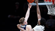 Virginia forward Thijs De Ridder (28) has his shot blocked by Vanderbilt center Jalen Washington (13) during the second half of their exhibition game at Memorial Gym in Nashville, Tenn., Thursday, Oct. 16, 2025.
