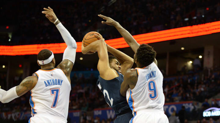 Dec 1, 2017; Oklahoma City, OK, USA; Minnesota Timberwolves center Karl-Anthony Towns (32) drives to the basket in front of Oklahoma City Thunder forward Carmelo Anthony (7) and forward Jerami Grant (9) during the second quarter at Chesapeake Energy Arena. Mandatory Credit: Mark D. Smith-USA TODAY Sports