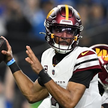 Washington Commanders quarterback Jayden Daniels throws a pass.