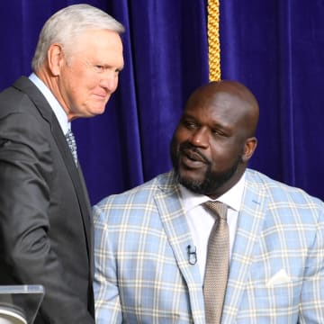Mar 24, 2017; Los Angeles, CA, USA; Jerry West (left) shakes hands with Los Angeles Lakers former center Shaquille O'Neal during a ceremony to unveil a statue of O'Neal at Staples Center. 