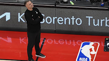 Nov 24, 2025; Toronto, Ontario, CAN; Toronto Raptors head coach Darko Rajakovic smiles as he looks up at the scoreboard during the second half against the Cleveland Cavaliers at Scotiabank Arena. Mandatory Credit: John E. Sokolowski-Imagn Images