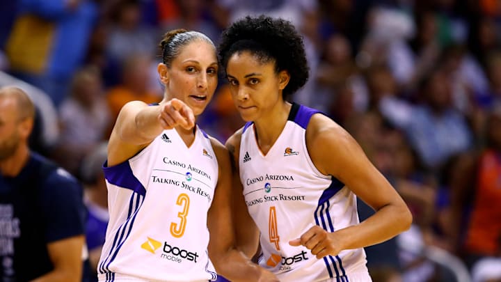 Sep 7, 2014; Phoenix, AZ, USA; Phoenix Mercury guard Diana Taurasi (left) talks with forward Candice Dupree against the Chicago Sky during game one of the WNBA Finals at US Airways Center. The Mercury defeated the Sky 83-62. Mandatory Credit: Mark J. Rebilas-Imagn Images