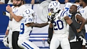 Sep 14, 2025; Indianapolis, Indiana, USA; Indianapolis Colts cornerback Mekhi Blackmon (29) reacts with safety Nick Cross (20) during the fourth quarter at Lucas Oil Stadium. Mandatory Credit: Robert Goddin-Imagn Images
