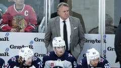 Winnipeg Jets head coach Rick Bowness stands behind the bench
