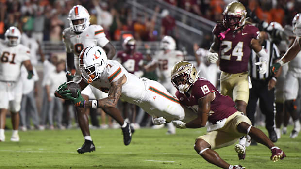Oct 4, 2025; Tallahassee, Florida, USA; Miami Hurricanes wide receiver CJ Daniels (7) scores a touchdown against Florida Stat