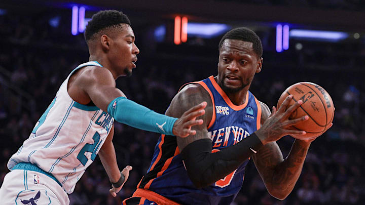 Nov 28, 2023; New York, New York, USA; New York Knicks forward Julius Randle (30) is defended by Charlotte Hornets forward Brandon Miller (24) during the first quarter at Madison Square Garden. Mandatory Credit: Vincent Carchietta-Imagn Images