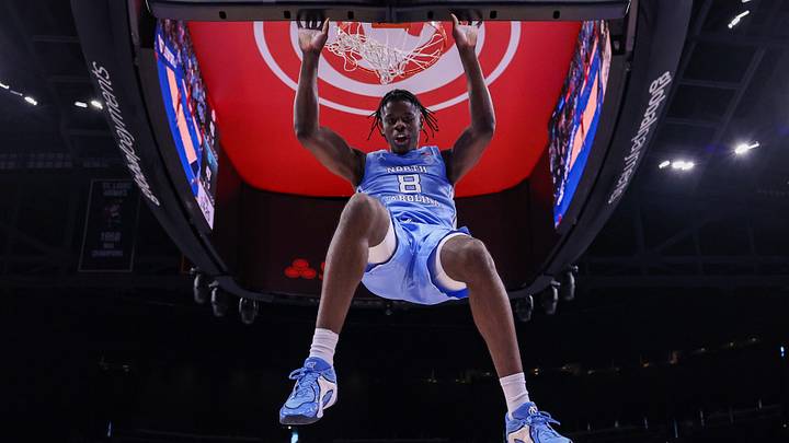 Dec 20, 2025; Atlanta, Georgia, USA; North Carolina Tar Heels forward Caleb Wilson (8) dunks against the Ohio State Buckeyes in the second half at State Farm Arena. Mandatory Credit: Brett Davis-Imagn Images