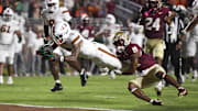 Miami wide receiver CJ Daniels scores a touchdown against Florida State defensive back Jerry Wilson.