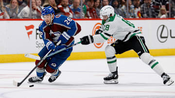 May 13, 2024; Denver, Colorado, USA; Colorado Avalanche defenseman Sean Walker (26) controls the puck ahead of v28 in the second period in game four of the second round of the 2024 Stanley Cup Playoffs at Ball Arena. Mandatory Credit: Isaiah J. Downing-Imagn Images