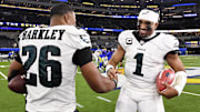 Jalen Hurts celebrates with Saquon Barkley after the Eagles defeat the Los Angeles Rams.
