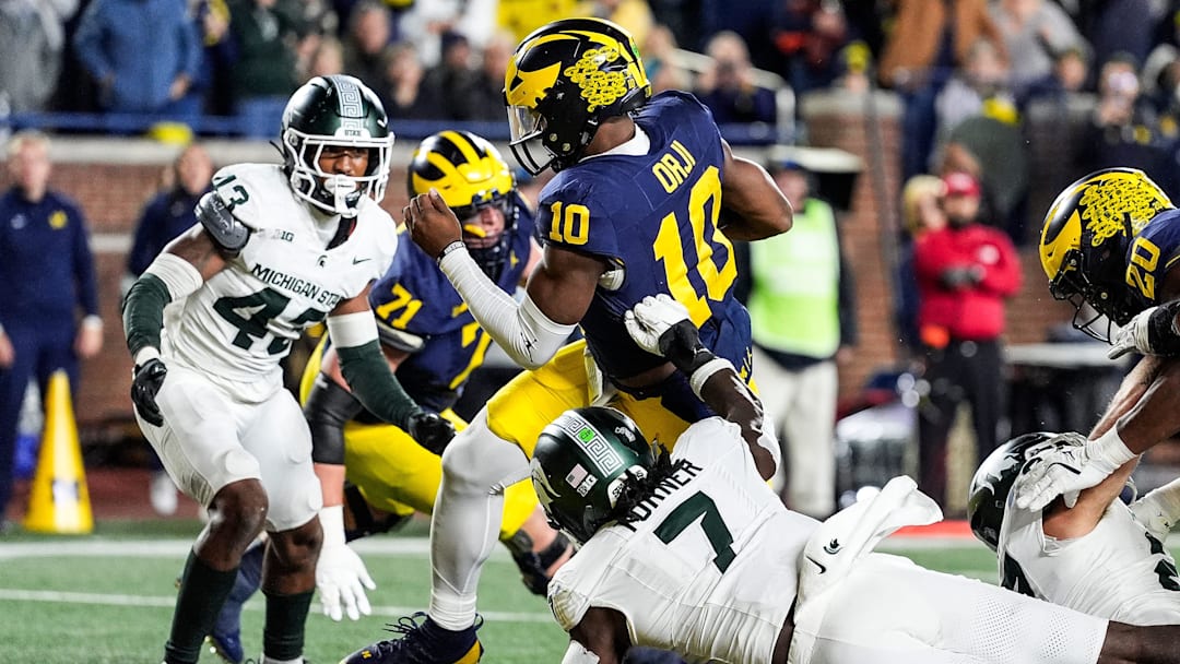Michigan quarterback Alex Orji (10) runs for a touchdown against Michigan State during the second half at Michigan Stadium in Ann Arbor on Saturday, Oct. 26, 2024.