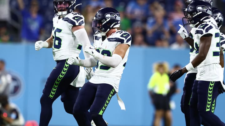 Aug 17, 2024; Nashville, Tennessee, USA; Seattle Seahawks safety Ty Okada (39) celebrates an interception late in the game against the Tennessee Titans at Nissan Stadium.