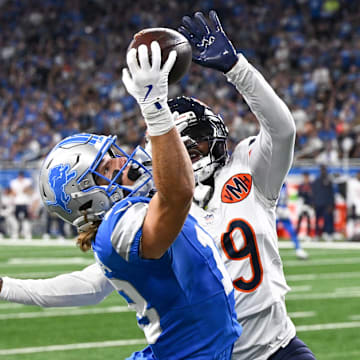 Sep 14, 2025; Detroit, Michigan, USA; Detroit Lions wide receiver Isaac TeSlaa (18) makes a reception defended by Chicago Bears cornerback Tyrique Stevenson (29) during the second quarter of the game at Ford Field. Mandatory Credit: Lon Horwedel-Imagn Images