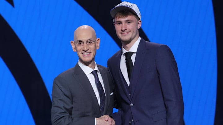 Jun 25, 2025; Brooklyn, NY, USA;  Cooper Flagg poses with NBA commissioner Adam Silver after being selected as first overall by the Dallas Mavericks in the first round of the 2025 NBA Draft at Barclays Center. Mandatory Credit: Brad Penner-Imagn Images