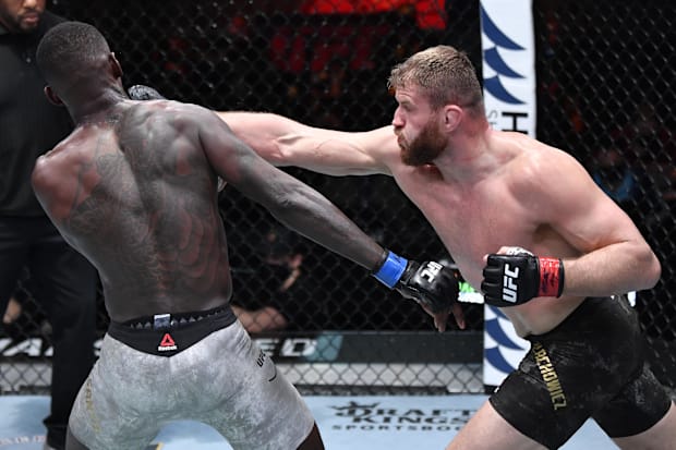 Jan Blachowicz punching Israel Adesanya