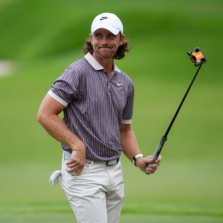 Tommy Fleetwood reacts to the crowd on the 18th green during the third round of the TOUR Championship