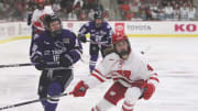 Wisconsin's Caroline Harvey (4) follows the puck after forcing St. Thomas' Ellah Hause to pass on Friday, March 1, 2024, at LaBahn Arena in Madison, Wis. 