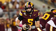 Oct 17, 2025; Minneapolis, Minnesota, USA; Minnesota Golden Gophers quarterback Drake Lindsey (5) takes a snap against the Nebraska Cornhuskers during the first half at Huntington Bank Stadium. Mandatory Credit: Matt Krohn-Imagn Images