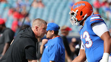 Oct 28, 2023; Jacksonville, Florida, USA; Florida Gators head coach Billy Napier and offensive lineman Bryce Lovett (53) prior to the game at EverBank Stadium. Mandatory Credit: Kim Klement Neitzel-Imagn Images