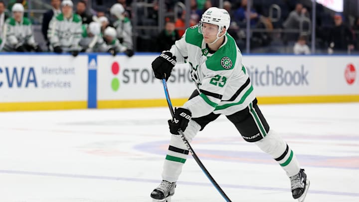 Jan 21, 2024; Elmont, New York, USA; Dallas Stars defenseman Esa Lindell (23) takes a shot against the New York Islanders during the third period at UBS Arena. Mandatory Credit: Brad Penner-Imagn Images