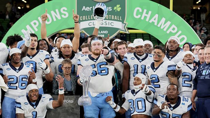 Aug 29, 2026; Dublin, Co. Dublin, IRL;  North Carolina Tar Heels offensive lineman Christo Kelly (56) celebrates with the Keogh-Naughton trophy after the game at Aviva Stadium.  Mandatory Credit: Laszlo Geczo-Imagn Images