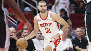 Former Houston Rockets guard Jack McVeigh (58) dribbles the ball.
