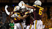 Oct 11, 2025; Minneapolis, Minnesota, USA; Minnesota Golden Gophers defensive back Kerry Brown (14) celebrates his interception against the Purdue Boilermakers during the first half at Huntington Bank Stadium. Mandatory Credit: Matt Krohn-Imagn Images